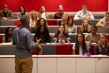 A law professor lecturing a class of law students.