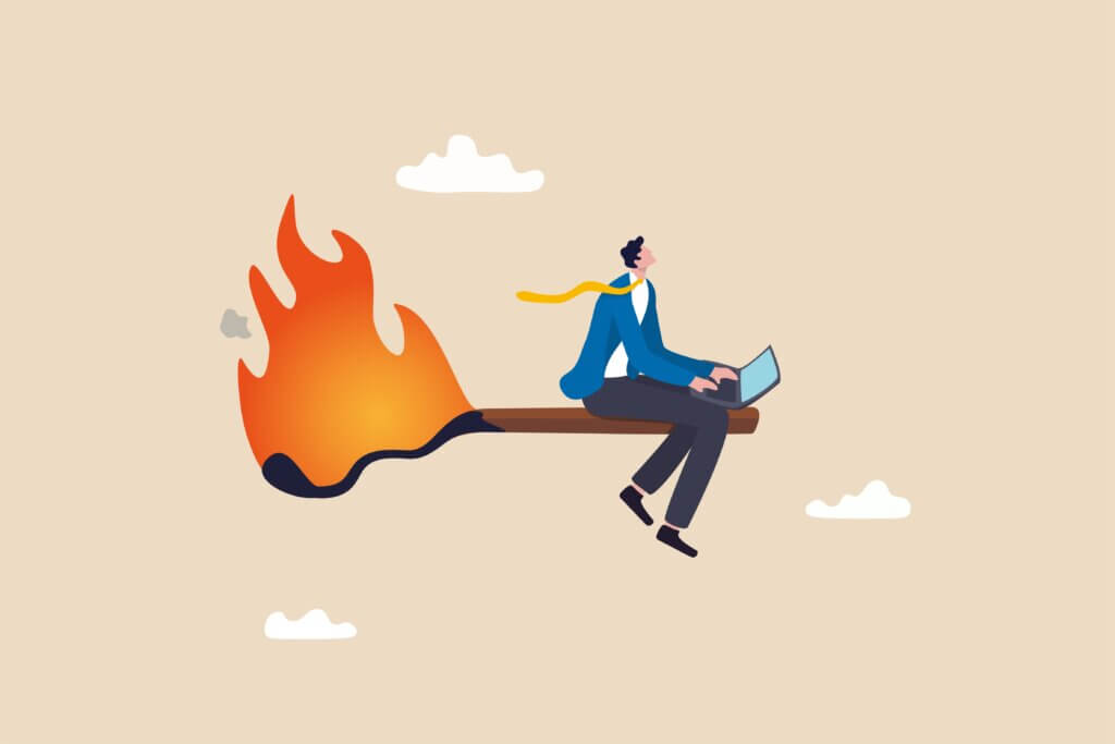 Lawyer experiencing burnout from being overworked or pressured to finish within deadline, frustration or exhausted worker, despair employee or trouble concept, desperate businessman working with laptop on burning matchstick.