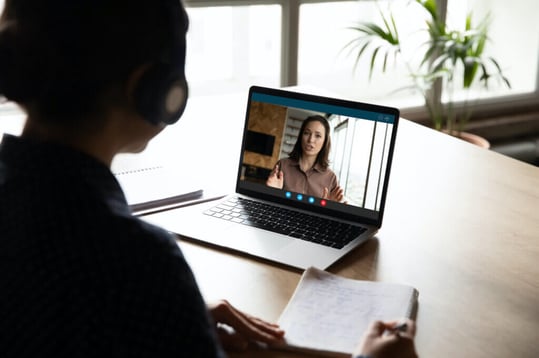 A person using a videoconferencing platform for a remote deposition